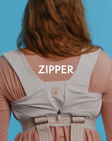 Woman wearing CoreXO back and posture vest activate vertical zipper for an extra level of support on your back for back pain relief, expanded chest capacity and posture alignment with comfortable materials that form to your skin for long term wear and muscle memory
